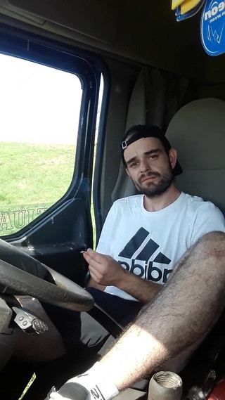 Jerking off in Shorts in a Parked Truck and Smoking a Cigarette