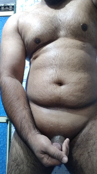 Muscular Indian Man Jerking While Standing