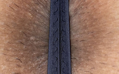 A Japanese man in women's underwear shows his buttocks and anus.