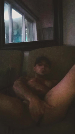 Hunk Hottie on Balcony Plays with His Hole and Strokes His Dick Until He Explodes All Over His Phone