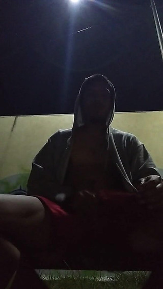 No Warm Shirt Man in Park with Only Sweater on Feeling Warm