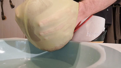 Playing with big balloon filled with piss