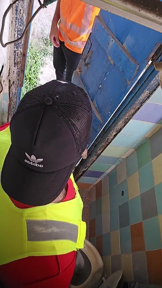 Two Construction Workers Making Out in the Company Bathroom.