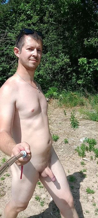 Naked Guy Walking in Nature