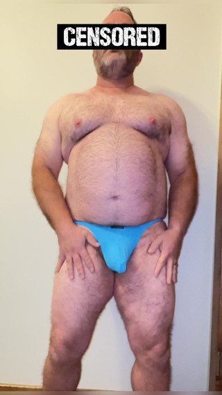 Anal Steve in His Blue Thong Showing off His Bear Body and Cock, with a Cock Ring on and Showing His Massive Butt Plug
