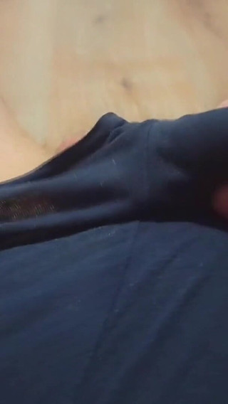 A Young Athletic Guy in Blue Shorts Is Massaging His Penis